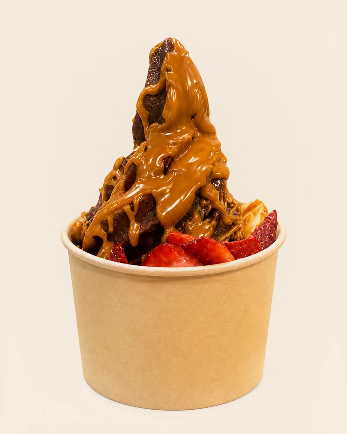 A Nabil's açaí swirl flooded with a thick caramel-toned drizzle, packed with strawberries