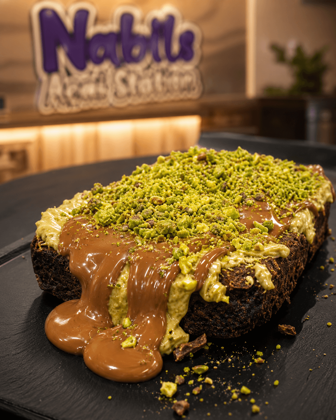 A Nabil's brownie dessert with milk chocolate and pistachio