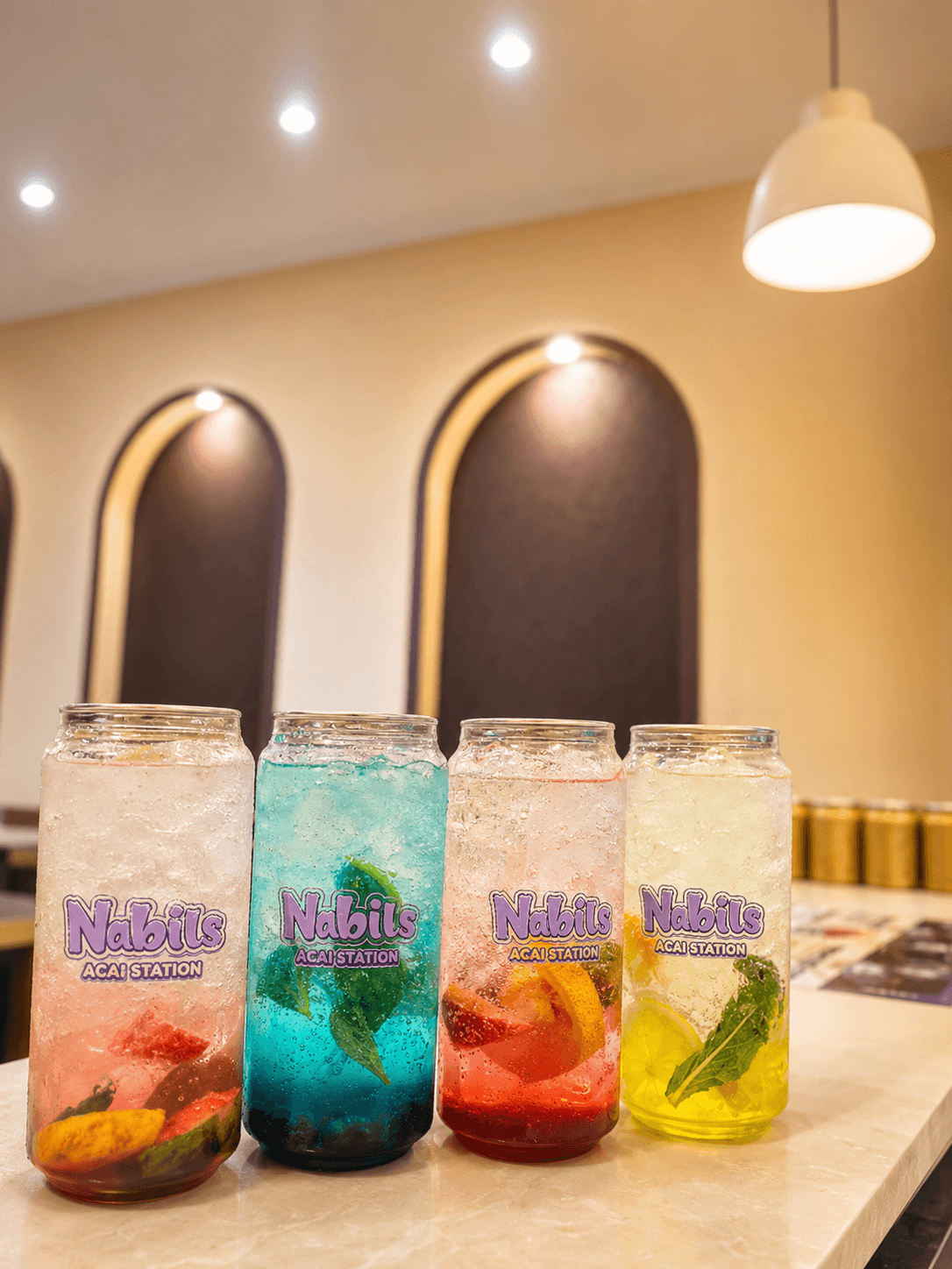 A bright Nabil's mocktail over ice