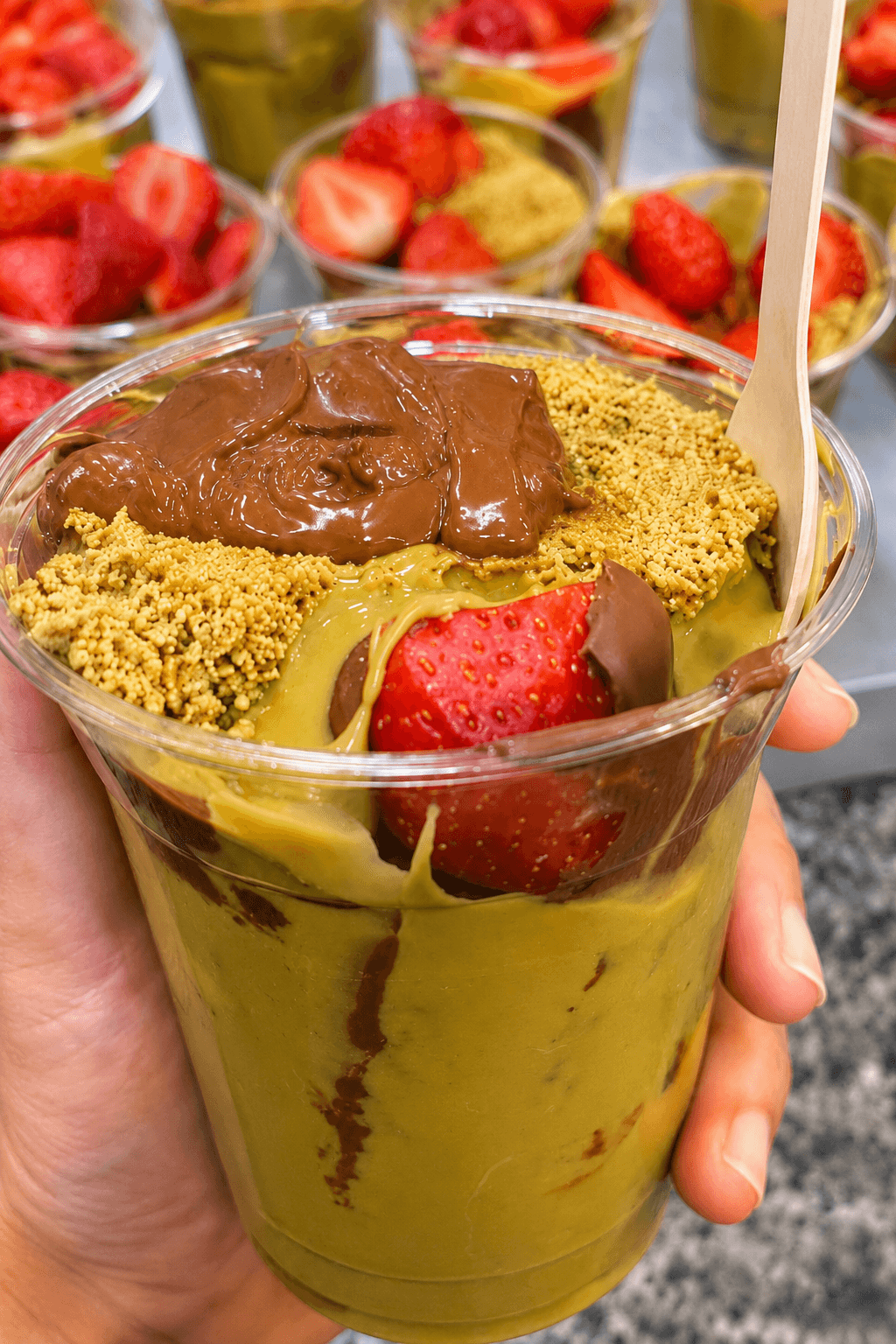 A Nabil's strawberry cup with milk chocolate and pistachio