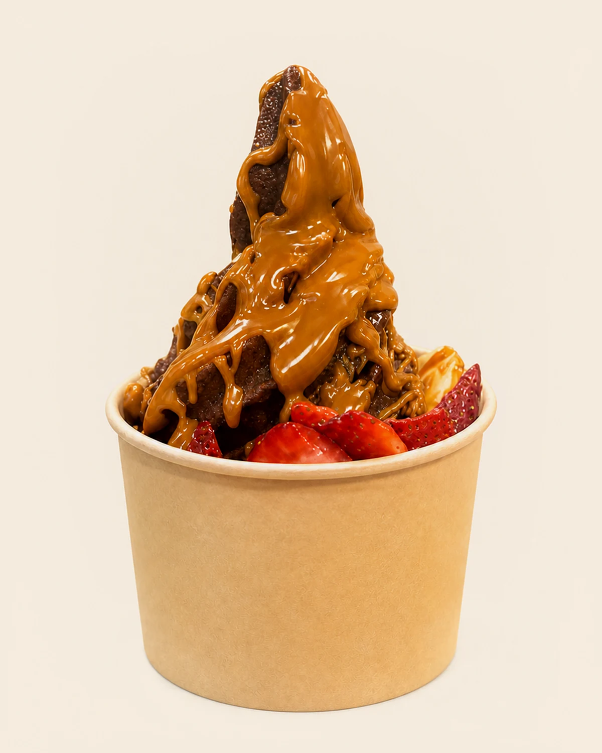 A Nabil's açaí swirl flooded with a thick caramel-toned drizzle, packed with strawberries
