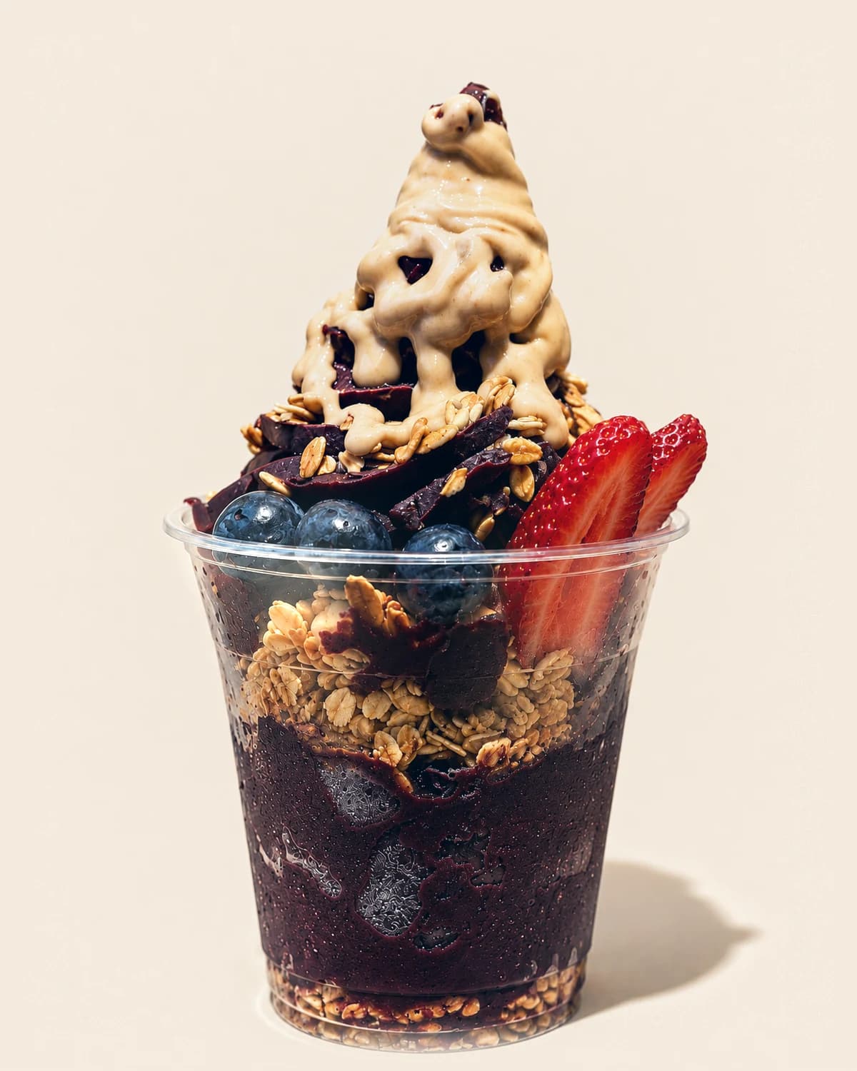 Nabil's açaí cup with granola, blueberries, strawberry and a drizzled swirl on top