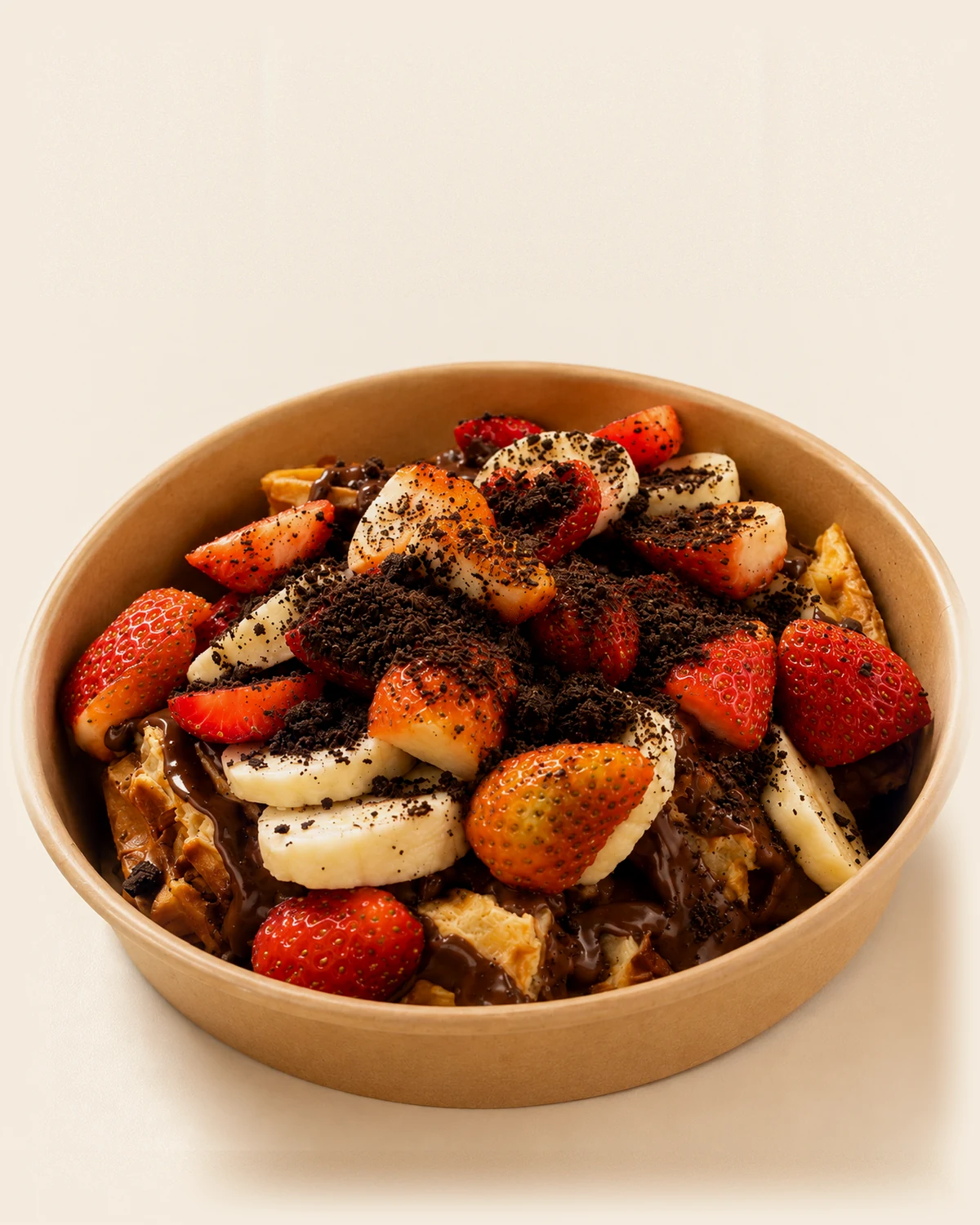 A Nabil's waffle snack pack with strawberries, banana and chocolate drizzle